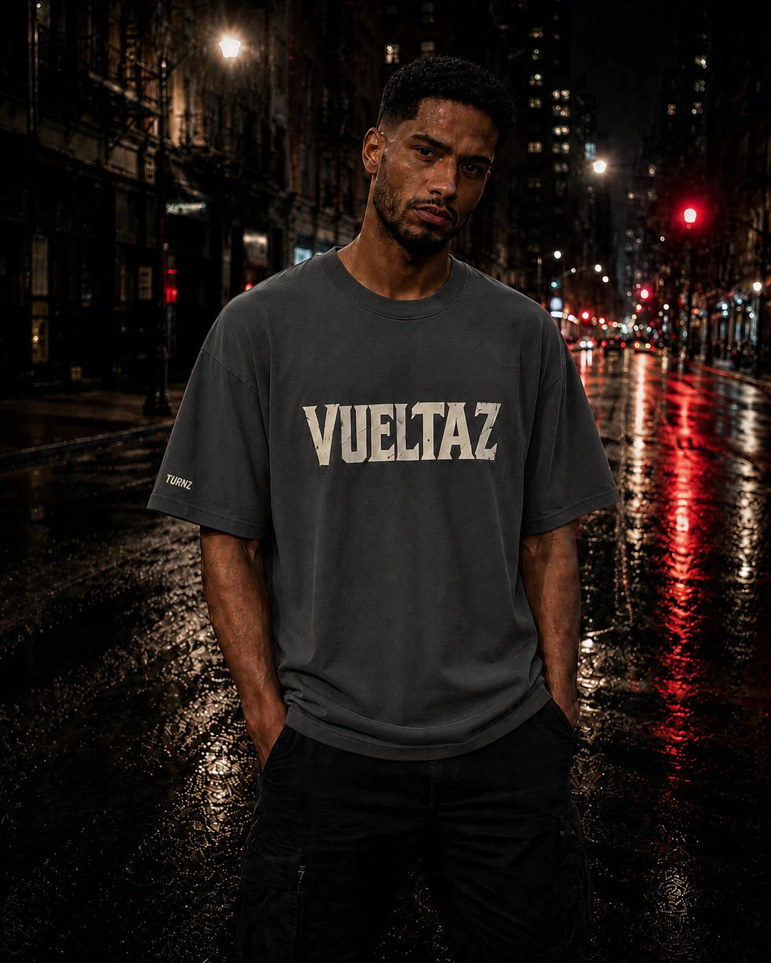 Male campaign model wearing the exact limited VUELTAZ oversized faded tee
